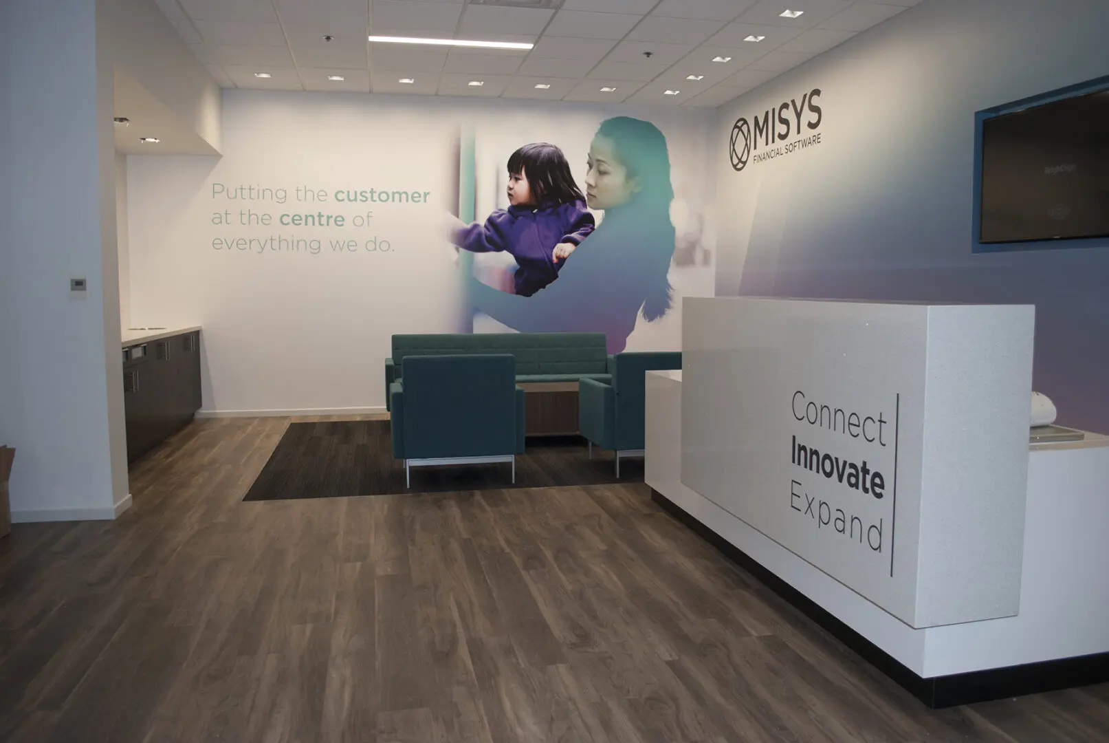 Office reception with mural of woman and child
