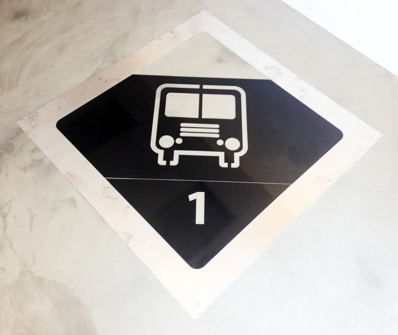 Bus stop floor symbol with number one