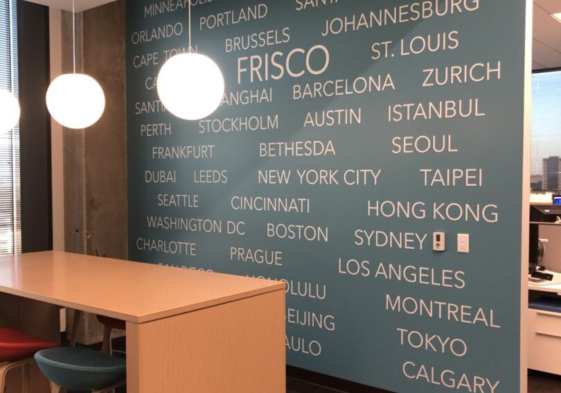 High table and hanging globes by city wall